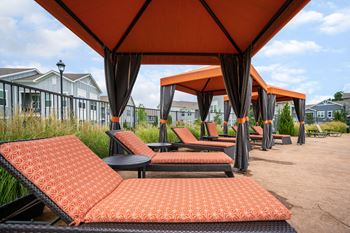 Resort-style swimming pool with cabanas